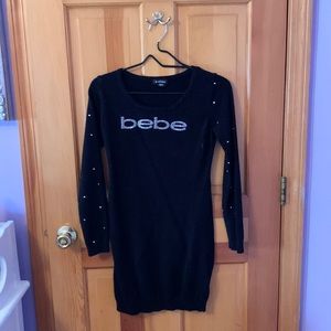 Bebe black long sleeved logo sweater dress with jewels on sleeves